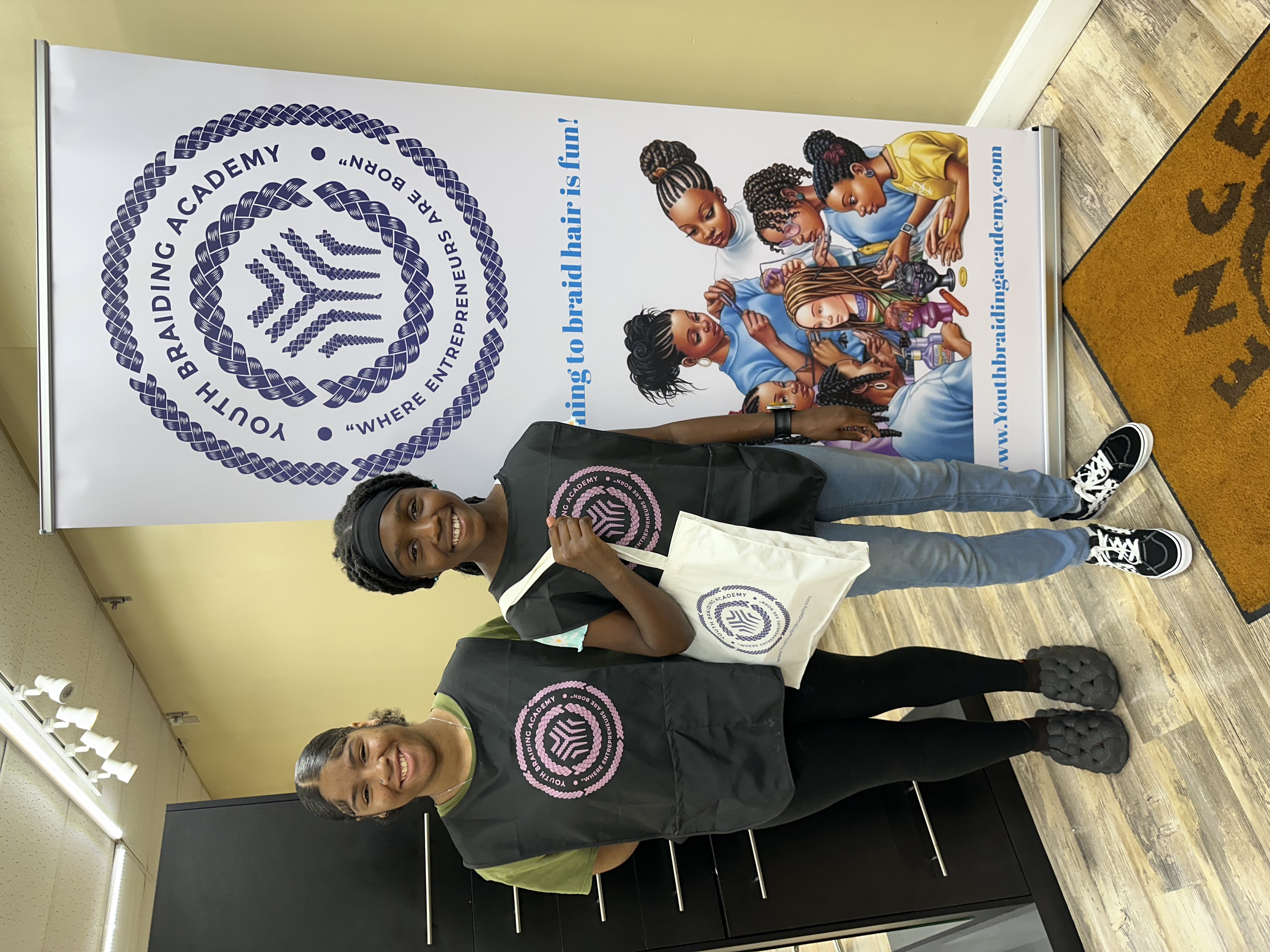 Students in Youth Braiding Academy smocks